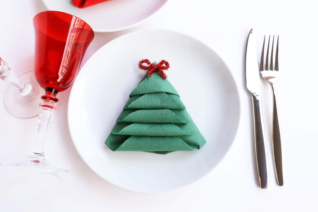 20 Cheap Christmas Decoration Ideas NZ: folded napkins | Swoosh Finance